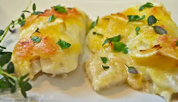 Lemon Parmesan Cod fish with fresh parsley and cheese on top.