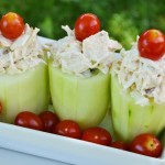 Cucumber Salad Cups with red cherry tomato toppers.