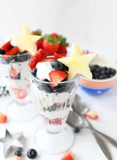Red White Blue Parfaits with fresh blueberries, strawberry, and apple star cutouts.