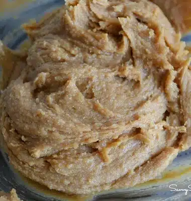 Peanut butter cookie dough in a glass bowl.