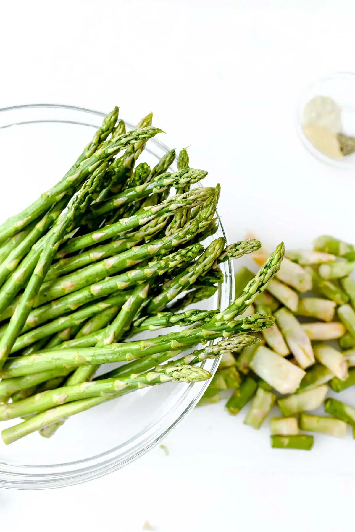 Asparagus with its tips cut off in a bowl.
