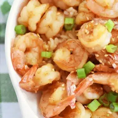 Honey Lime Shrimp in a white dish with a green checkered napkin.