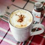 A mug with an eggnog latte inside.