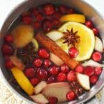 A small stockpot with colorful potpourri ingredients.