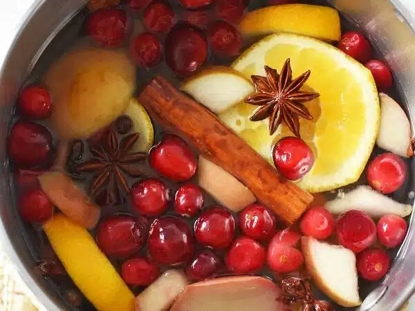 A small stockpot with colorful potpourri ingredients.
