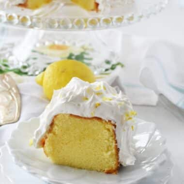 Lemon chiffon Cake slice on white, flowered plates.