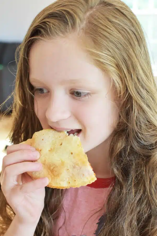 Girl Eating a Quesadilla