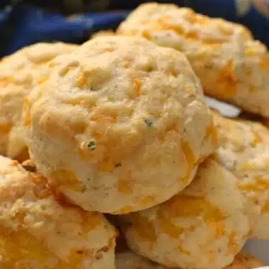Cheddar Cheese Biscuits on a white plate.