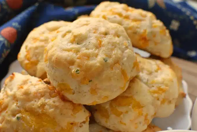 Cheddar Cheese Biscuits on a white plate.