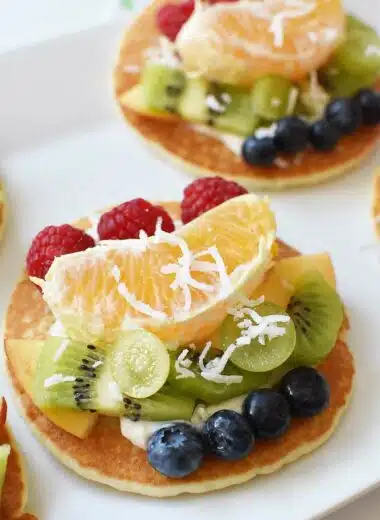 Pancakes topped with fruit and yogurt