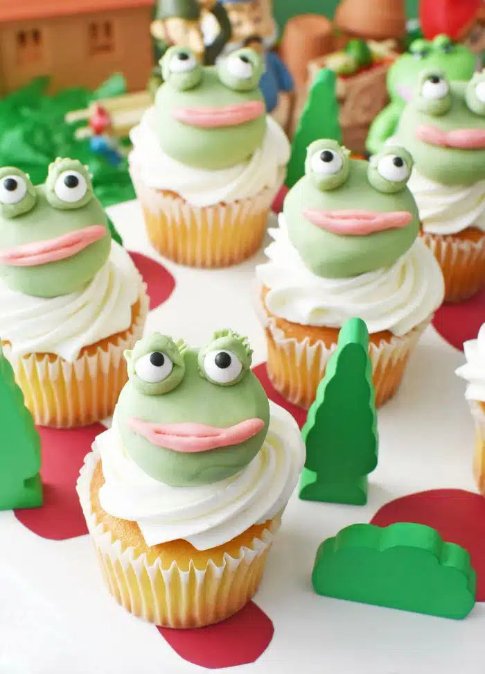 Mushroom cake display with frog cupcakes