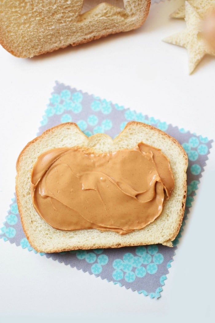 Jiff Peanut Butter on a slice of white bread. 