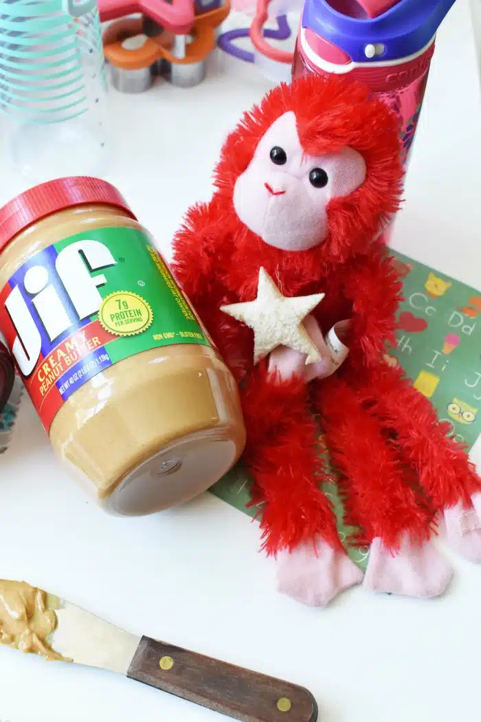 Red monkey with peanut butter jar. 