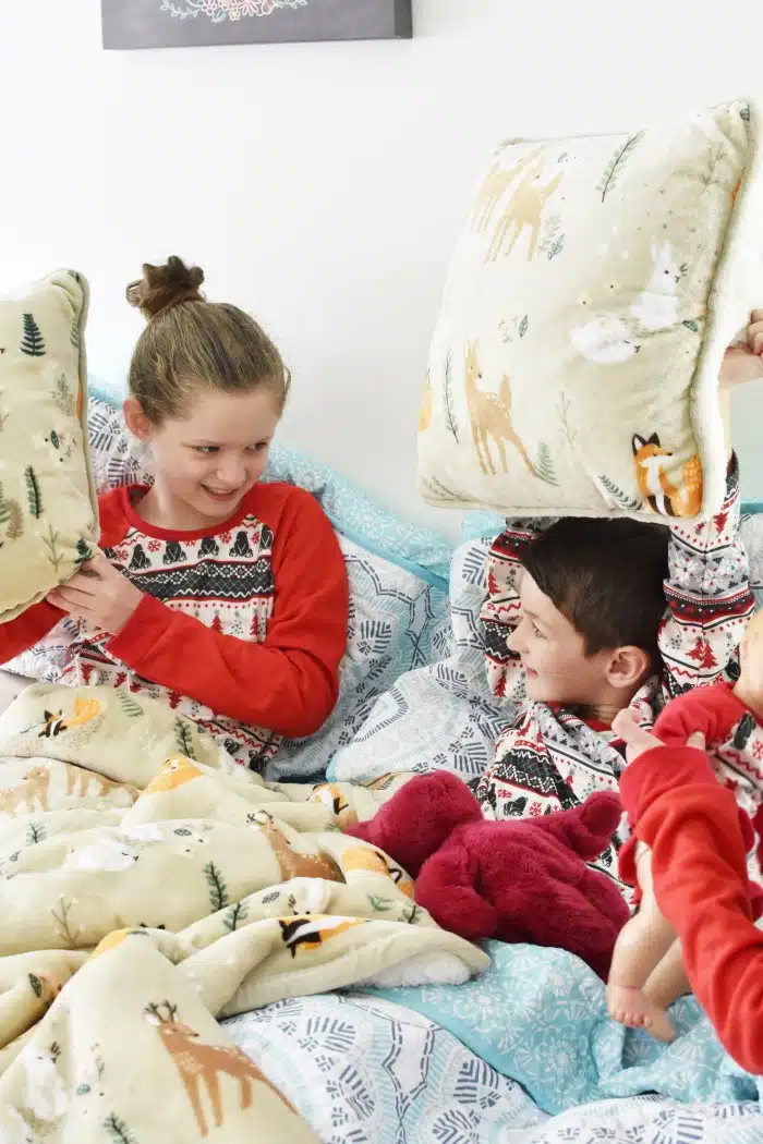 Kids playing on bed 1