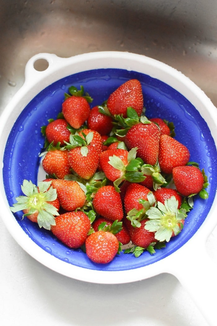 Rinsed strawberries in collander 1