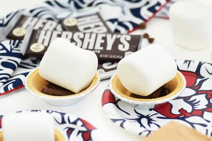 jumbo marshmallows atop mini pies  