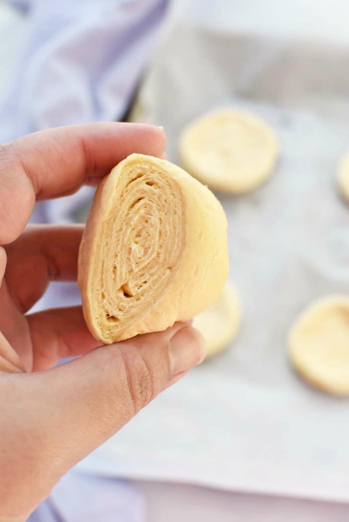 Sliced crescent roll dough in hand