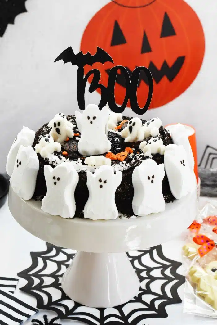 Peeps Ghost Cake on white cake stand.