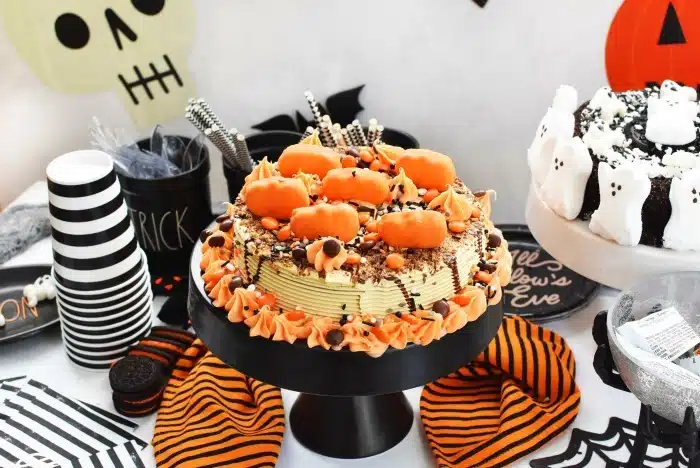Reeses Decorated Halloween Cake on Halloween themed table.