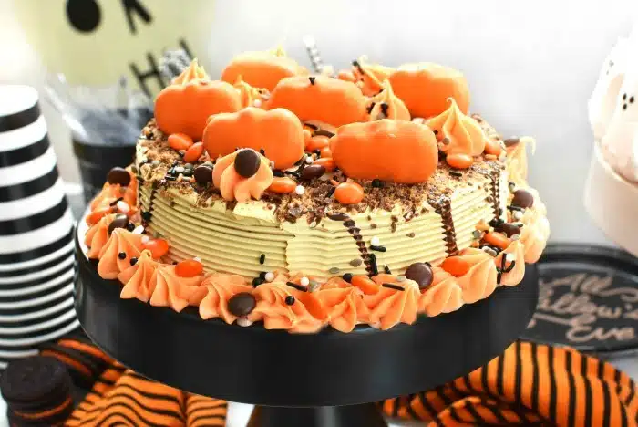 Reeses Halloween Ice Cream Cake on black cake stand.