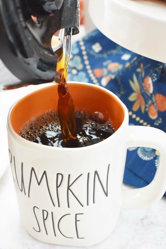 Coffee pouring into a Pumpkin Spice Mug. 