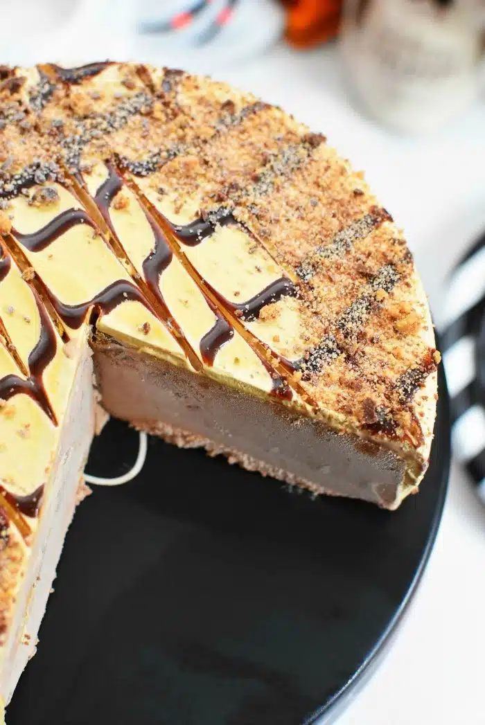 Reeses Ice Cream Cake Sliced with a piece missing.