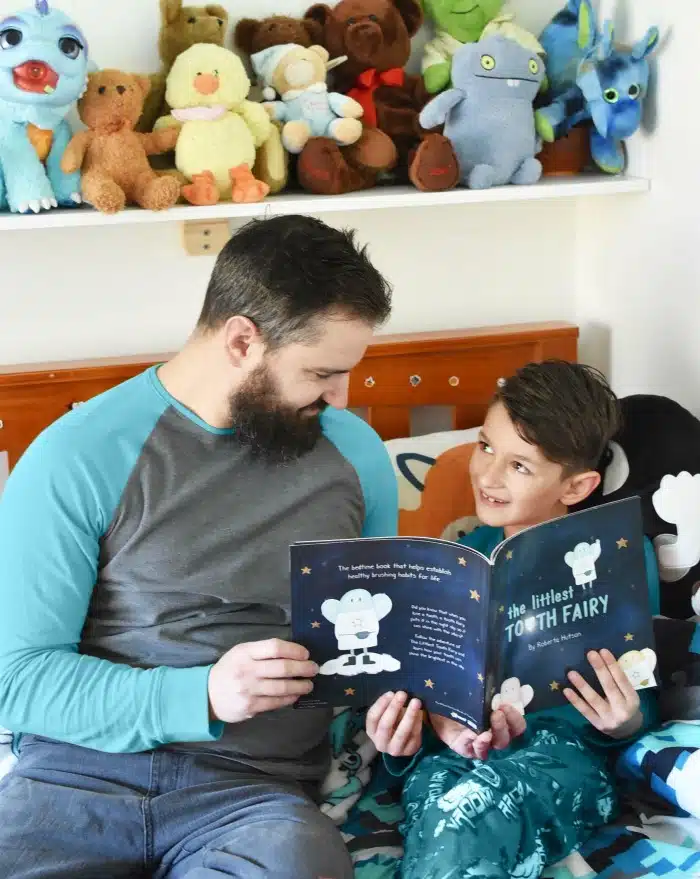 Father Reading to Son in his bedroom. 
