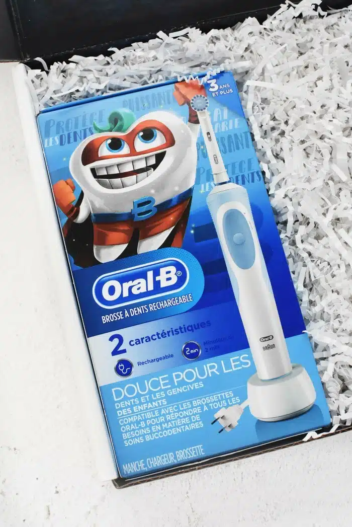 Oral B Kids Electric toothbrush on white table. 