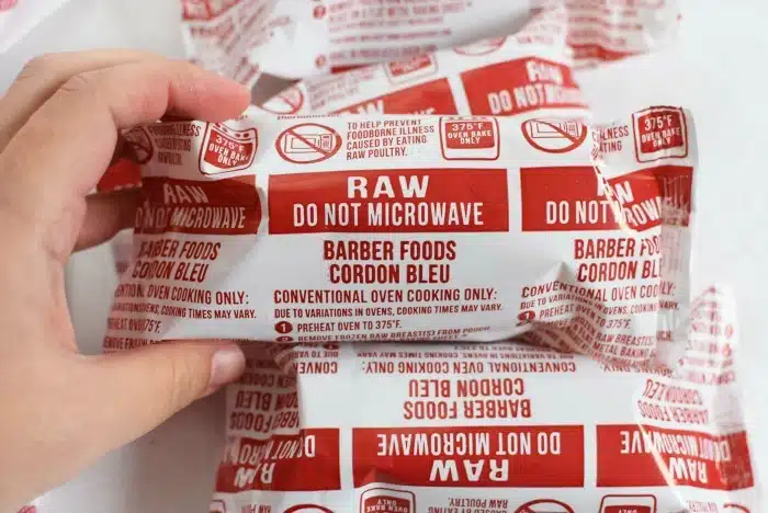 Raw Barber Foods Cordon Bleu packs in hand. 