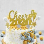 2020 New Year Cake with gold and silver gumballs and star picks.