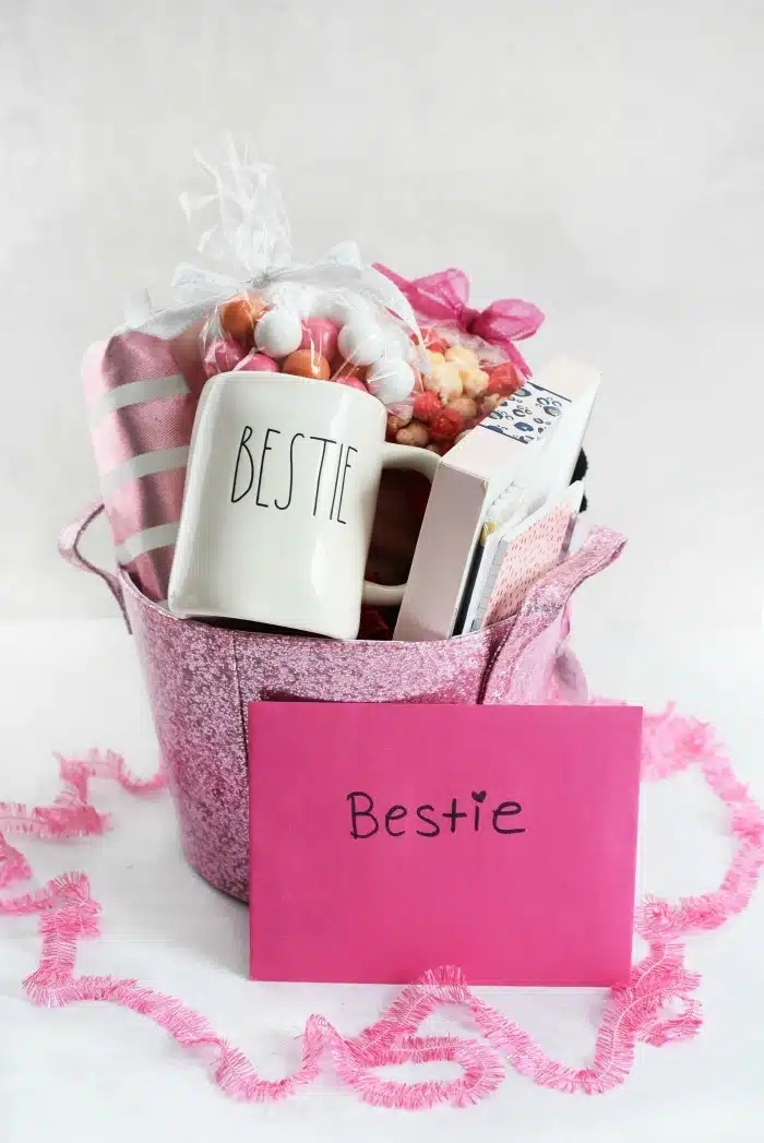 Pink bestie Gift Basket on a white table. 
