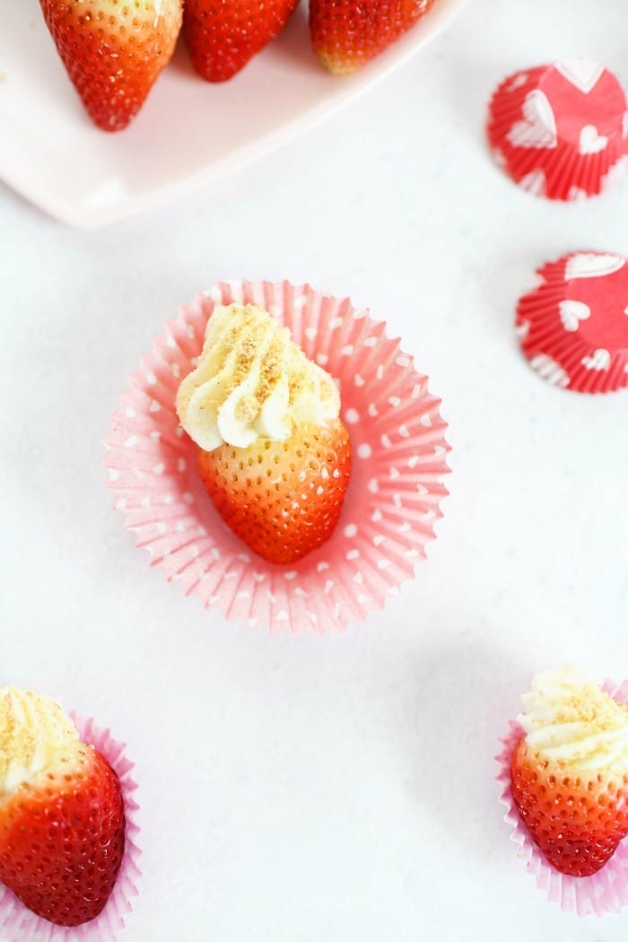 Cheesecake strawberries in red dot paper. 