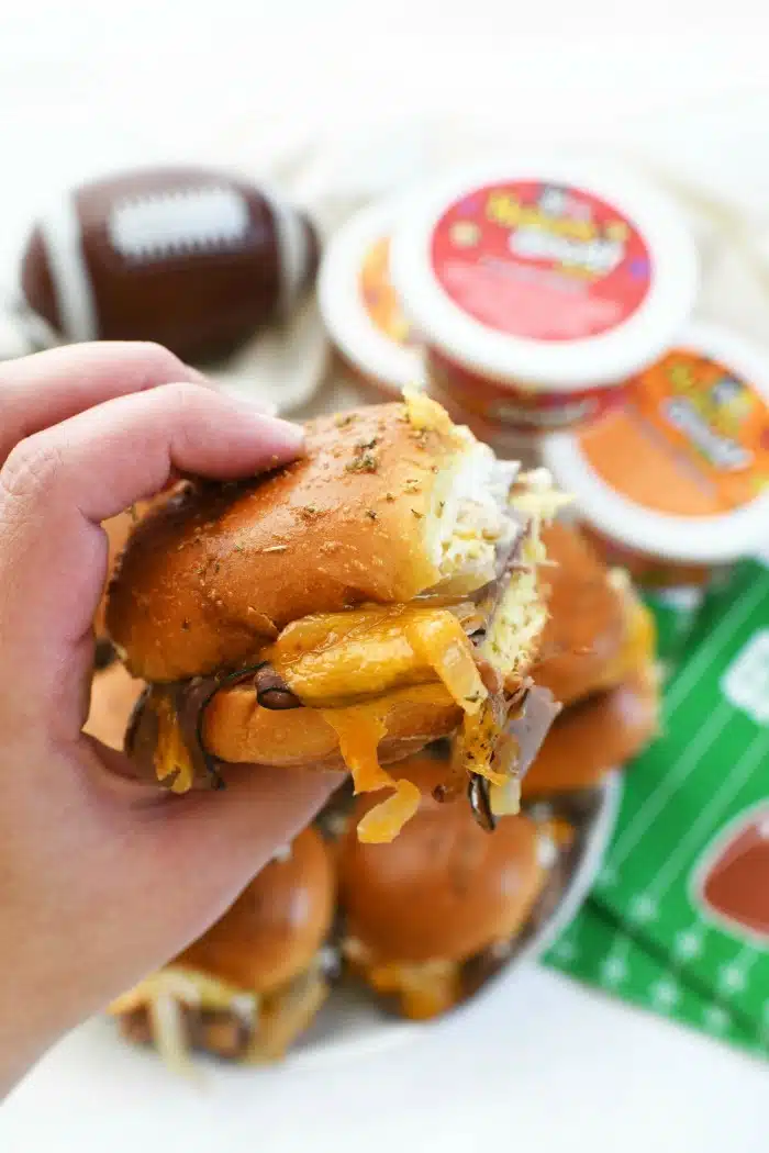 Cheesy Roast Beef & Onion Slider in hand.