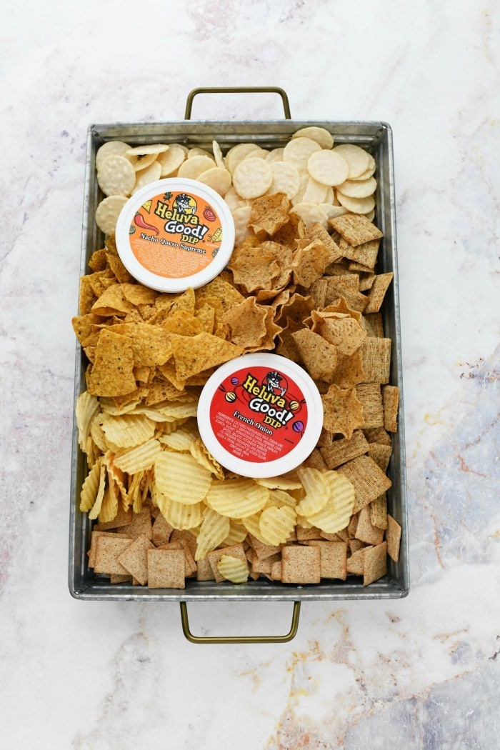 Metal Chips and Dip Tray with handles filled with chips and dips. 