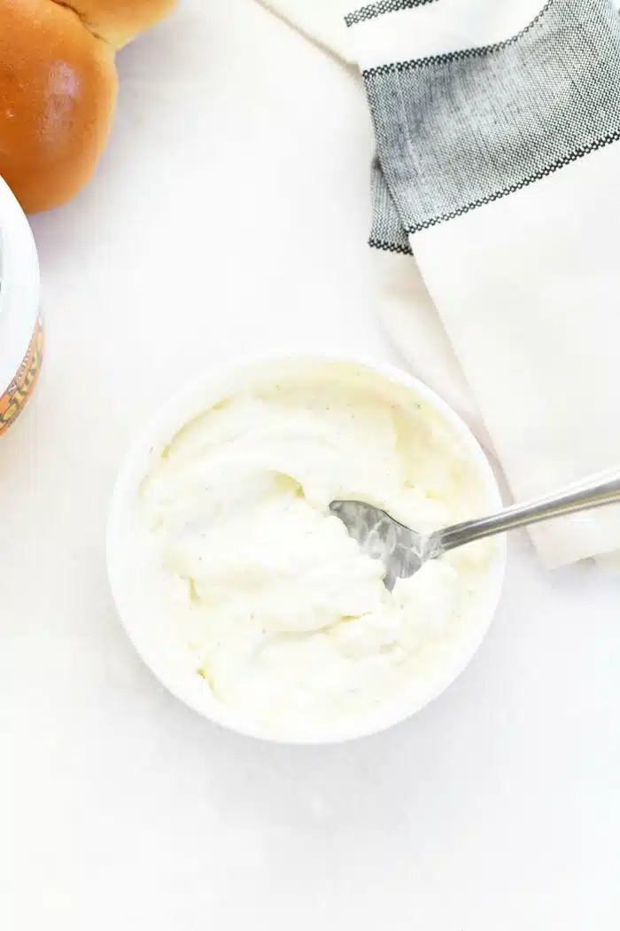 Heluva Good French Onion Dip Cup opened and dip stirred.
