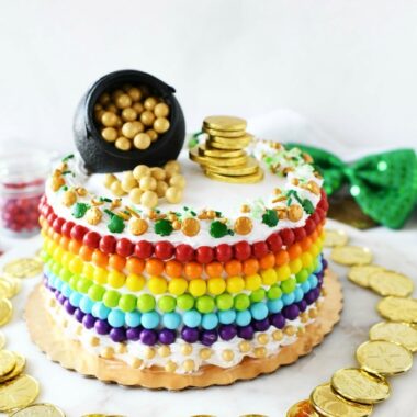 St Patricks Cake with gold coins, candy Sixlets, and sprinkles.