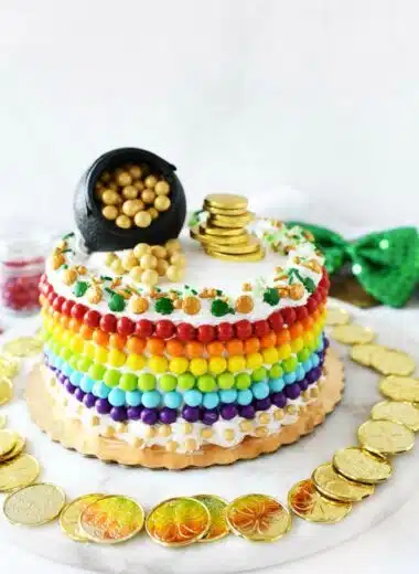 St Patricks Cake with gold coins, candy Sixlets, and sprinkles.