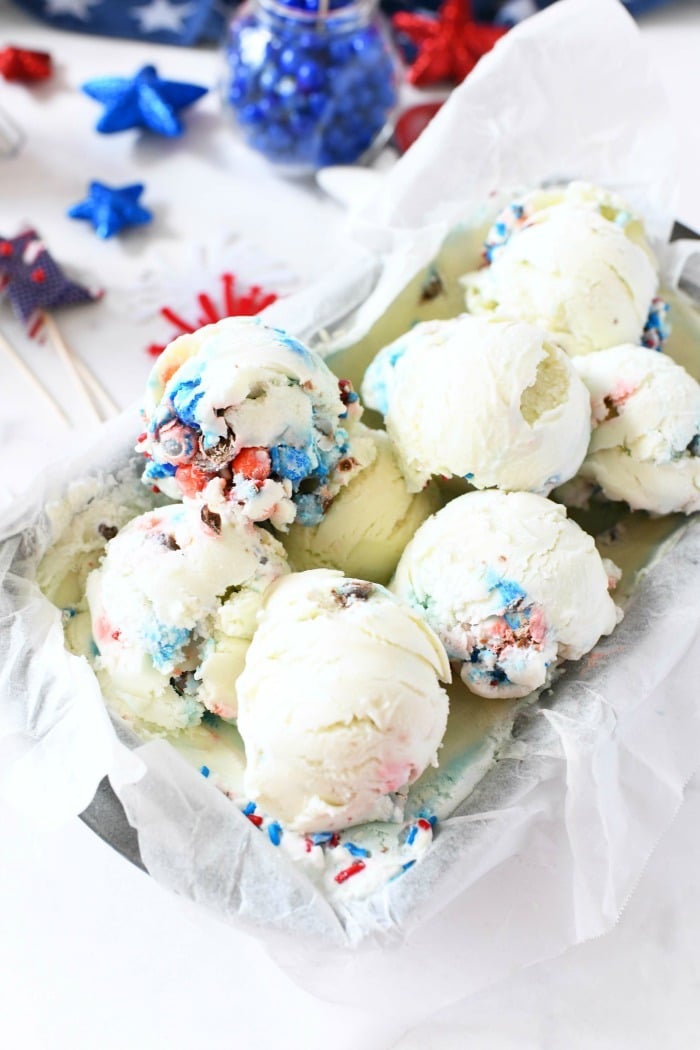 Red white blue ice cream scoop balls in frozen pan.