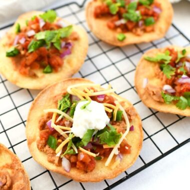 Baked Tostadas on a wire rack.