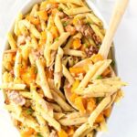 Butternut Squash Penne on white table in a white oval dish.