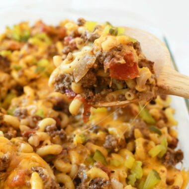 Hot and cheesy Cheeseburger Casserole on a wooden spoon.