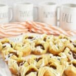 Mini Pumpkin Pie Puff Pastry Bites near Rae Dunn fall mugs.