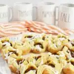 Mini Pumpkin Pie Puff Pastry Bites near Rae Dunn fall mugs.