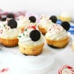 OREO peppermint cheesecakes on a white cake stand.