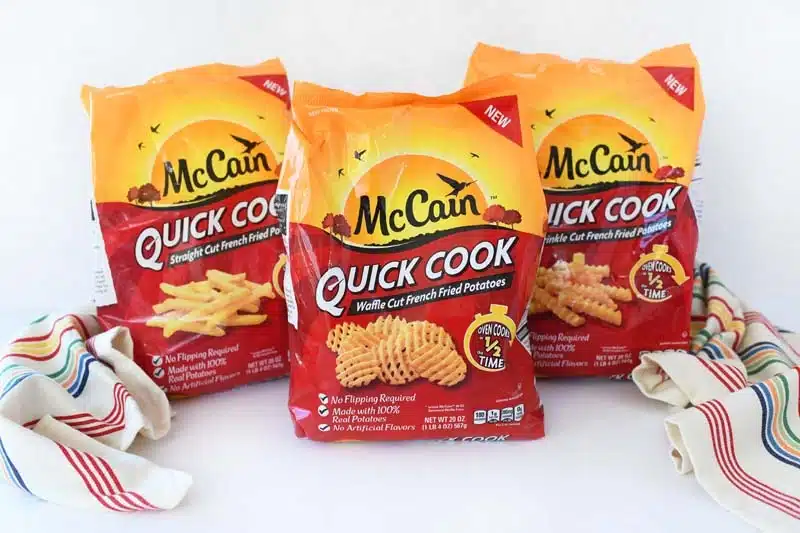McCain Quick Cook French Fries on a white table with a colorful striped napkin.