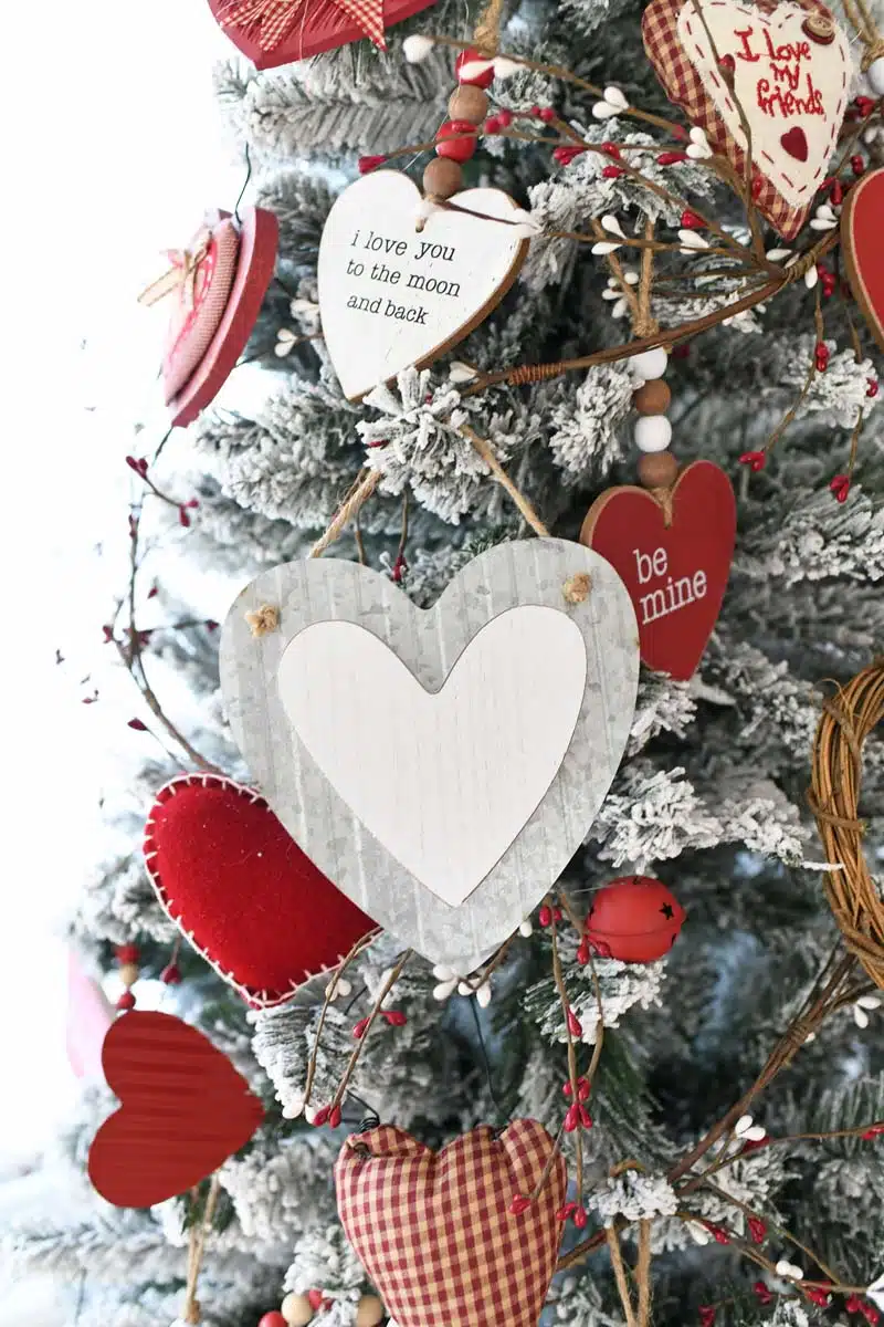 Metal Heart Ornaments hanging on a flocked Valentines Day Tree.