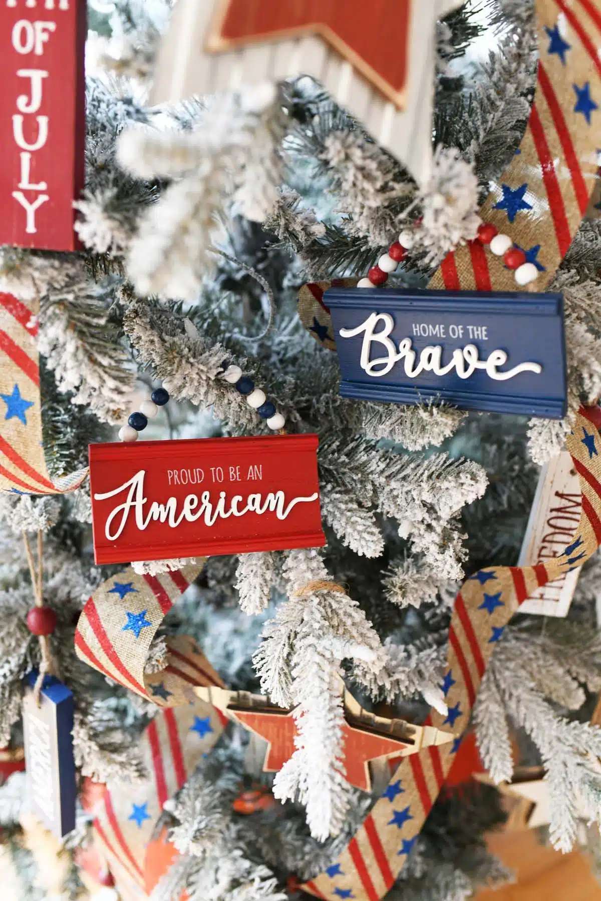 Red, white, and blue Americana Ornaments on a Christmas tree.