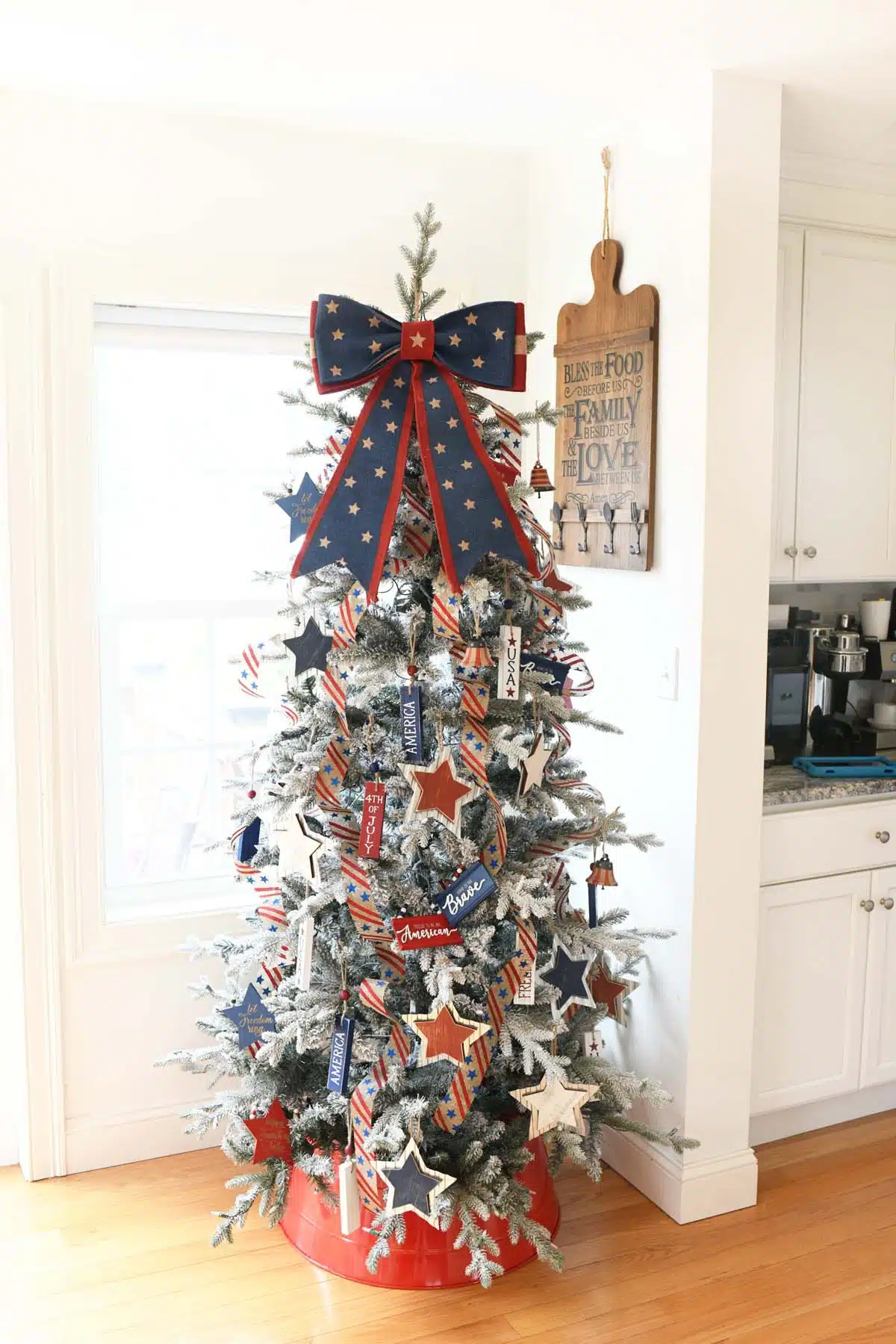 Americana Tree with a red, and blue star bow topper.
