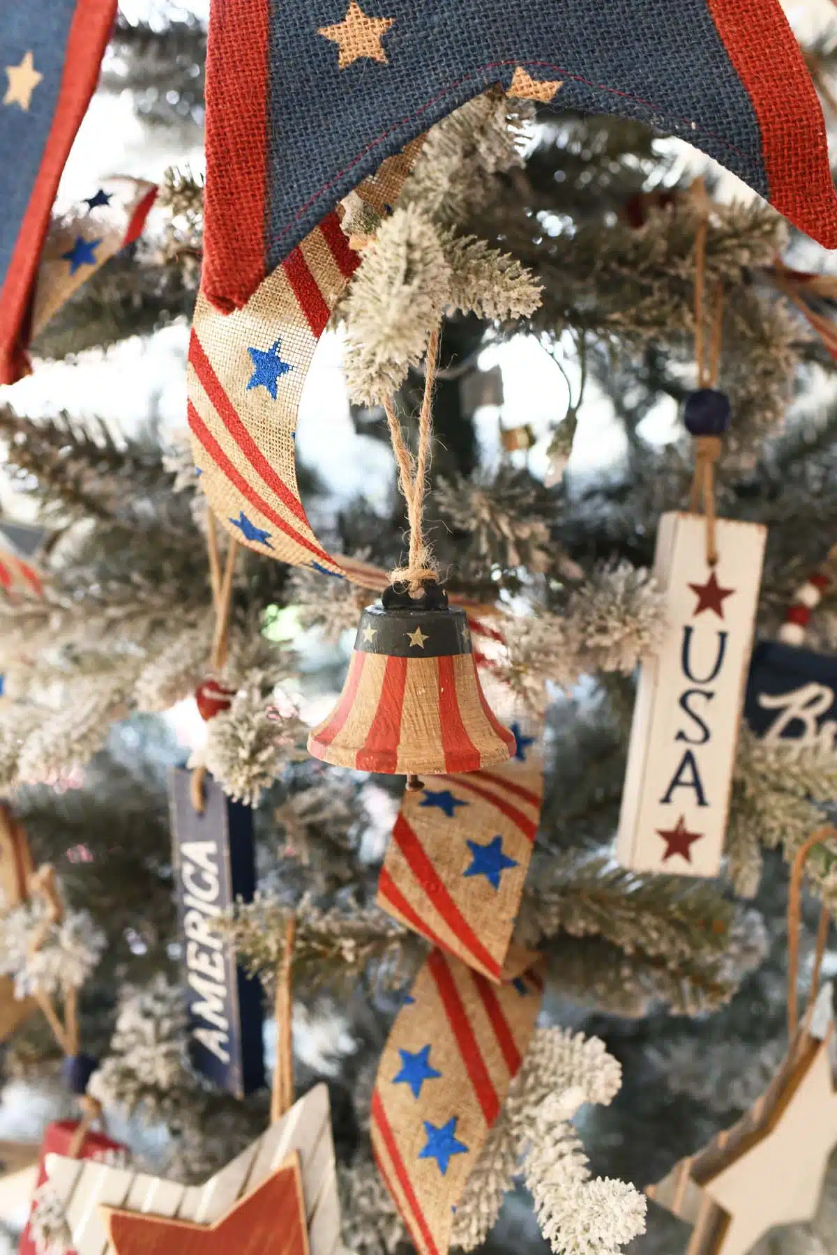 Patriotic Liberty Bell ornament on a Christmas Tree.