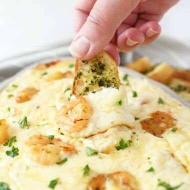 Cheesy Shrimp scampi on an herbed crostini.